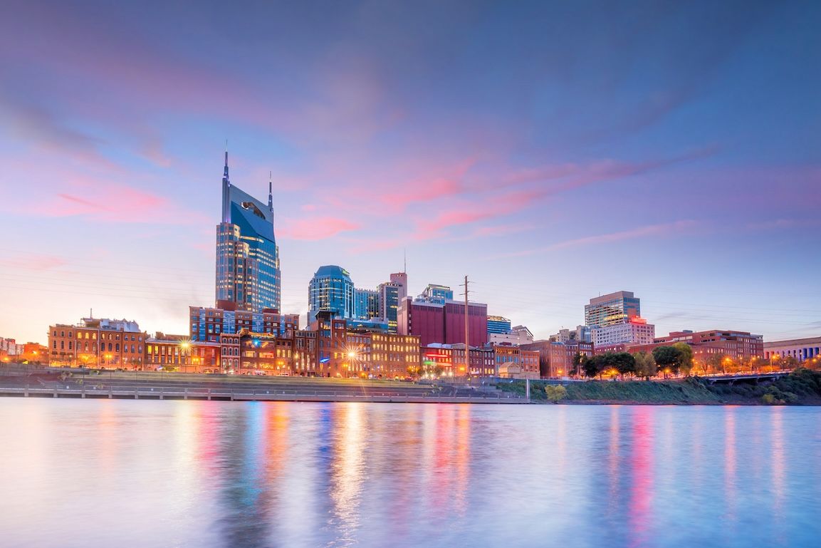 Nashville, Tennessee downtown skyline with Cumberland River in USA at sunset