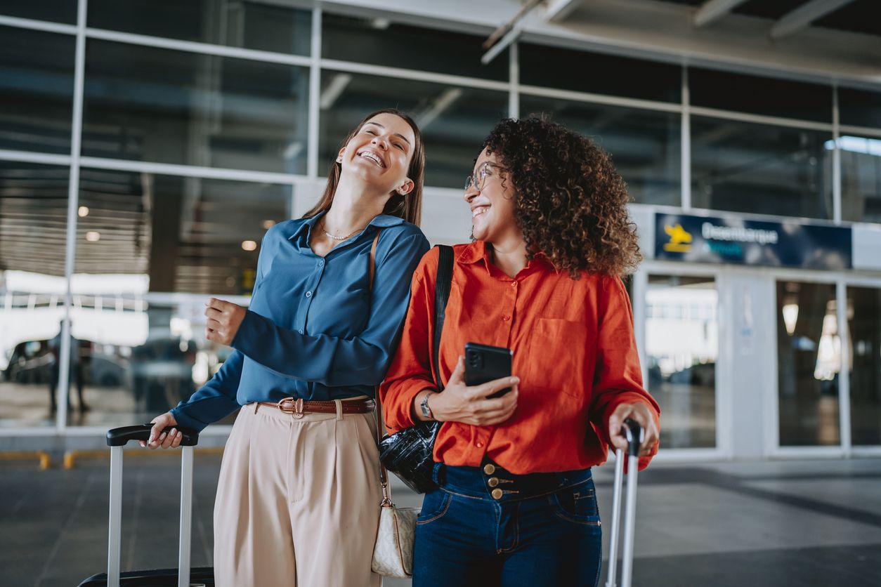 two females waiting for the airport shuttle at BNA