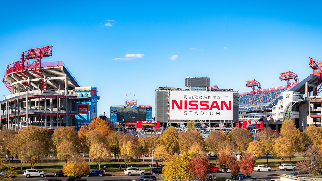 Nissan Stadium in Nashville, Tennessee with autumn foliage along the Cumberland River, home of the Tennessee Titans.