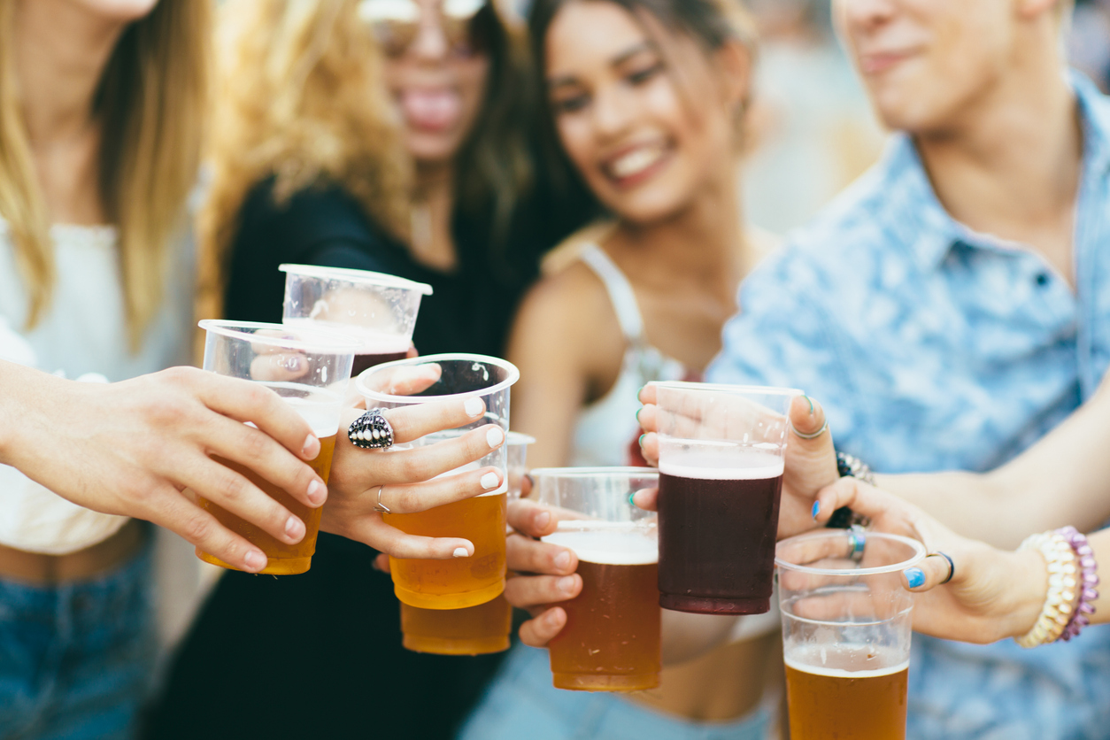 Friends toast beers at the Tennessee Beer, Wine and Shine Festival in Nashville.